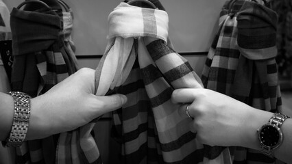 Reaching for a scarf (b/w)