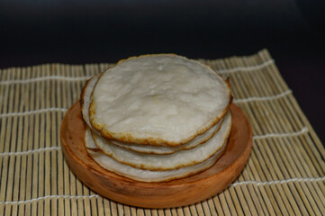 Serabi, Indonesian traditional pancakes, made of rice flour, flour and coocnut milk. Serve with palm sugar sauce.