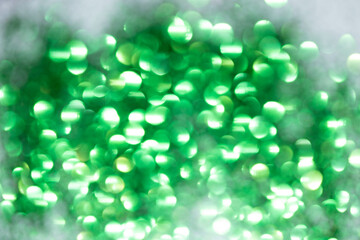 Sparkling Glitter on White Background Bokeh Abstract Close Up Green