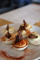 Unique deviled eggs on a plate at a table at a restaurant in downtown Columbus, Ohio.