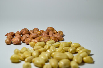 Kacang goreng or fried peanuts. Indonesian snacks. Isolated on a white background. Selective focus