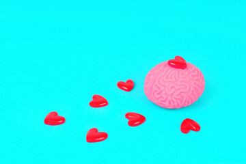 Human Brain and Red Heart Shapes on Blue