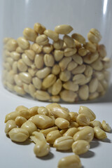 Kacang goreng or fried peanuts. Indonesian snacks. Isolated on a white background. Selective focus