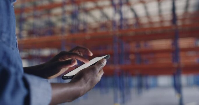 Phone, screen and hands of man in factory for architecture, engineering or communication online. Building, construction or mobile app with closeup of contractor with graphs, warehouse and charts