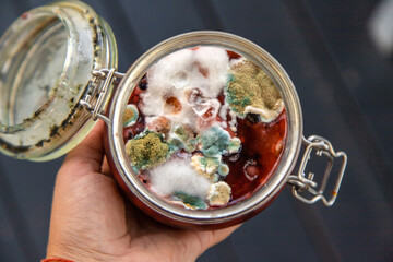 The jam in the jar is moldy. Selective focus. - obrazy, fototapety, plakaty