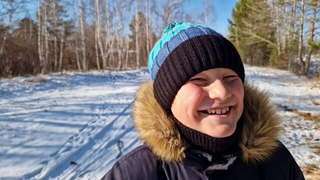 Explore the enchanting essence of childhood in this stock footage Witness the pure delight of a child's laughter during a winter stroll - a heartwarming portrayal of joy innocence and wintertime bliss