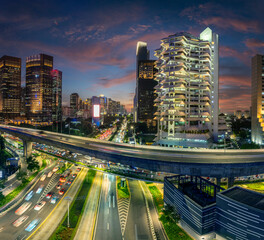 Fototapeta premium Panoramic view of jakarta City, Indonesia, with beautiful sunset. Jakarta is the largest city in indonesia that also the center of governance and business district. 