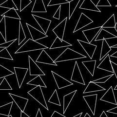 Silhouette chaotic triangle on black seamless