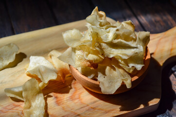 Keripik talas or taro chips is made of deep fried thin slice taro . Crispy savory snack. Typical Indonesian traditional chips.