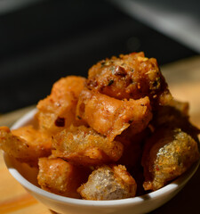 Snack on dry dumplings or  siomay cikruh. Made from dumpling skin and tapioca flour which are fried and seasoned.