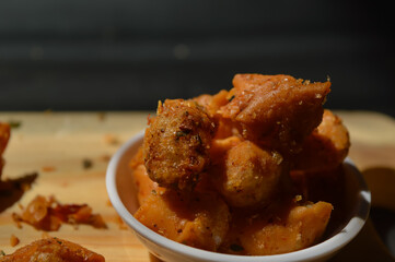 Snack on dry dumplings or  siomay cikruh. Made from dumpling skin and tapioca flour which are fried and seasoned.