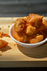 Snack on dry dumplings or  siomay cikruh. Made from dumpling skin and tapioca flour which are fried and seasoned.