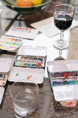 watercolor paints and wine