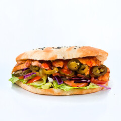 Flatbread with tomatoes, chicken, pork, lettuce, cheese, pickled cucumbers, cabbage and jalapeno pepper on white background.