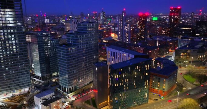 Manchester Cityscape At Dusk And Traffic Flowing Down On Mancunian Way