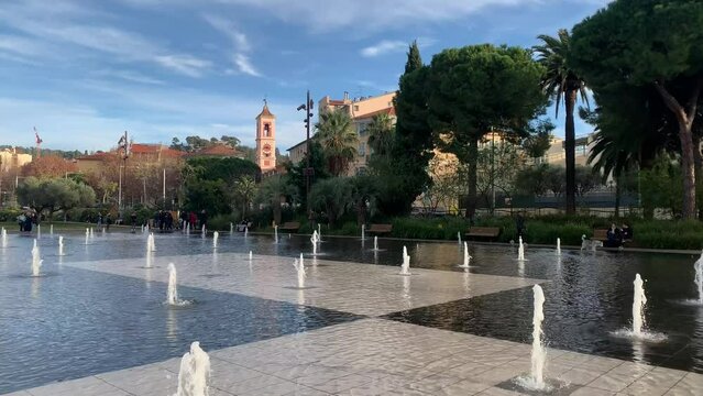 Tiny water fountains are running at Promenade du Paillon Park. Splashing water jets. Park at Nice city centre. Popular recreation and sightseeing place. Nice, Cote d'Azur, France