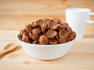 Chocolate breakfast cereal in a white bowl