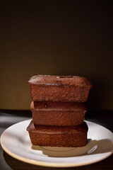 Chocolate block cake is a traditional cake made from flour, vanilla, eggs, sweetened condensed milk, baking soda, margarine and sugar.