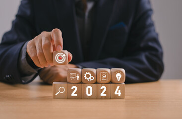 Businessman setup business trend 2024 strategy action target, Start calendar 2024 plan concept....