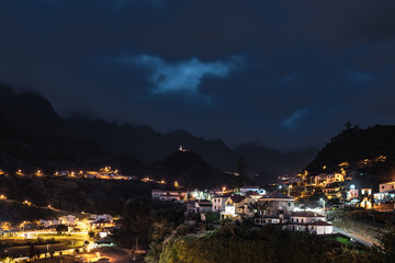 Night-time atmosphere and streetlights of the picturesque village on the north coast in a green, overgrown valley. Sao Vincente, Madeira Island, Portugal, Europe.
