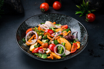 Meat salad with chicken slices, potatoes, onion, honey mushrooms, arugula, lettuce and cherry tomatoes.