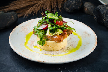 Fried sausages with mashed potatoes and fresh salad of cucumber, radish, tomato, lettuce and arugula.