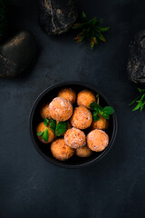 Dessert fried curd balls in powdered sugar with mint.