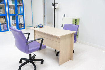 Interior of empty physician office with desk and chairs.Modern and bright doctor office with copy...