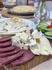 delicious appetizer with cheese and ham top view