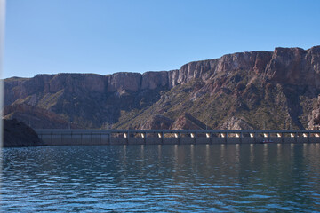 View of mountains, blue lake and part of the dam