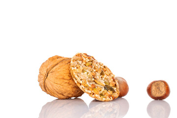 One sweet Thaler cookie with nuts, macro, isolated on white background.	