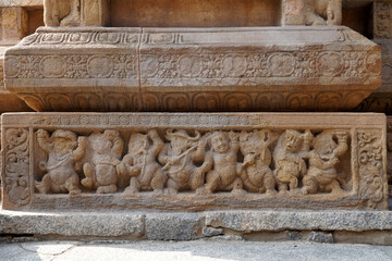 Carving of Dwarf-like Yakshas in Temple. Sandstone relief carving of ancient mythological sculptures on the wall of historic Kailasanathar temple in Kanchipuram.