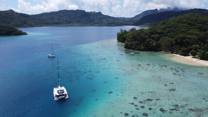 Cruise boats in Auea Bay, Huahine, Leeward Islands, French Polynesia