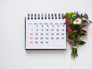 Calendar lies on the table in the office. Daylight. Close-up, indoors. Studio shot. Finance and...