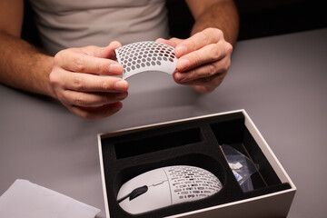white new wireless computer mouse flat lay with led lights