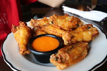 Chicken wings and dip served on a plate at a restaurant in Columbus, Ohio	