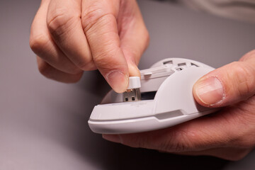 white new wireless computer mouse flat lay with led lights