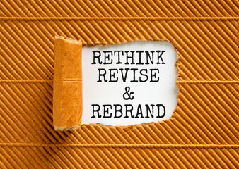 Rethink revise rebrand symbol. Concept word Rethink Revise and Rebrand on beautiful paper. Beautiful brown paper background. Business brand motivational rethink revise rebrand concept. Copy space