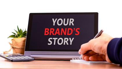 Branding and your brand story symbol. Concept words Your brands story on beautiful tablet screen. Beautiful white background. Businessman hand. Business branding your brand story concept. Copy space.