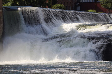 Fototapeta premium Waterfall and dam in a small river town in West Virginia. 