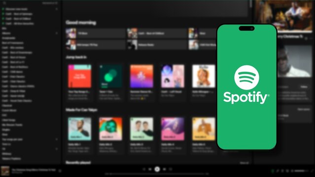 Istanbul, Turkey - 25 January 2024: Spotify brand logo on smartphone screen with Spotify website in background. Spotify is a leading global music streaming platform. Illustrative Editorial.