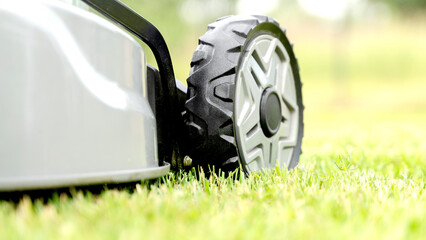 lawn mower on a freshly mowed flat lawn