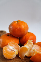 tangerines on a wooden board