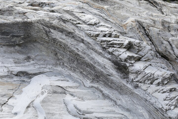 natural stone with many curves and furrows black white, textures for photo compositions
