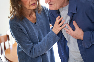  Wife giving husband first aid during heart attack and chest pain