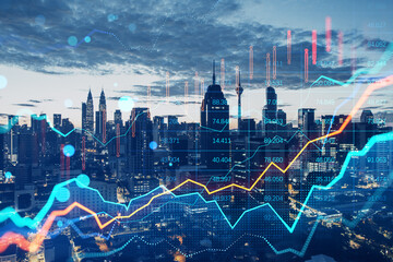 Glowing forex chart on blurry bokeh night city background. Trade, finance and market concept....