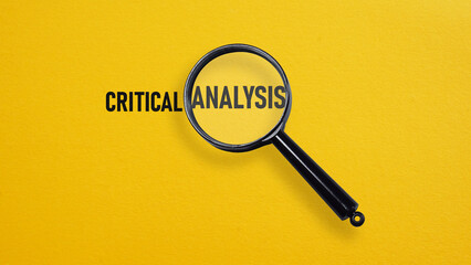 Critical analysis is shown using the text and the photo of magnifying glass