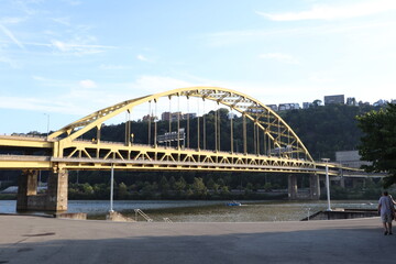 Andy Warhol Bridge and other famous yellow bridges in downtown Pittsburgh, Pennsylvania.  Over Point State Park. Panoramic view of downtown.