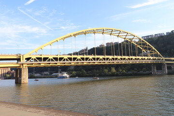 Andy Warhol Bridge and other famous yellow bridges in downtown Pittsburgh, Pennsylvania.  Over Point State Park. Panoramic view of downtown.