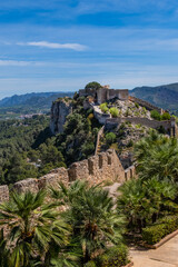 Fototapeta na wymiar Xativa Castle or Castillo de Xativa - ancient fortification on the ancient roadway Via Augusta in Spain. Medieval ruins of the walls of Xativa castle. Xativa, Spain, Europe.